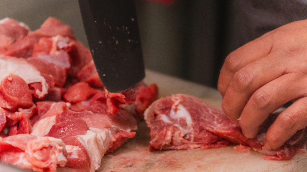 meat on the table being cut